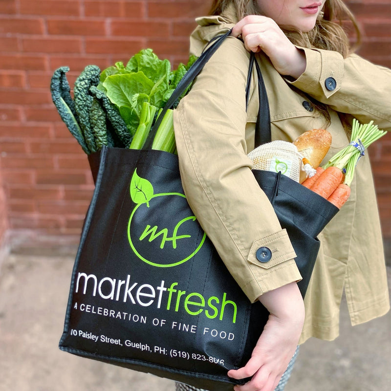Woman carrying Market Fresh Cloth Bag full of groceries